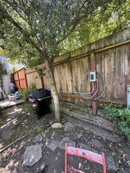 Sauna disconnect with conduit run along a backyard fence β Zion Electric Inc., San Leandro electrician