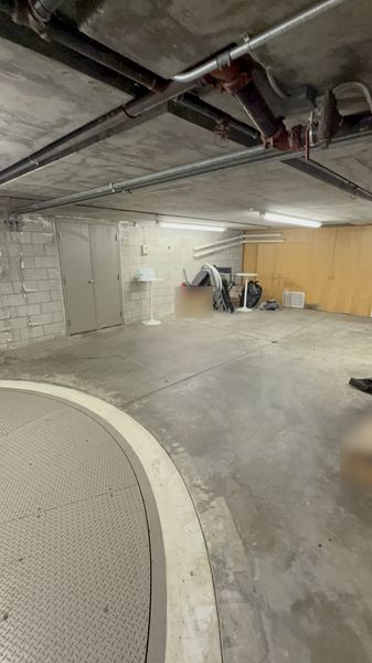 Conduit runs along the ceiling of a building parking garage β Zion Electric Inc., San Leandro electrician