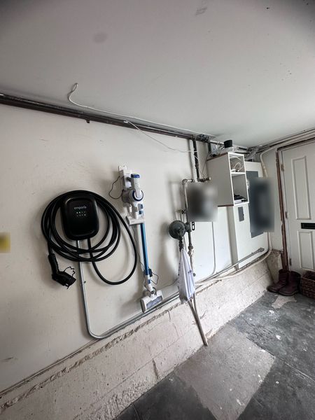 Emporia EV charger installed on a garage wall with conduit β Zion Electric Inc., San Leandro electrician