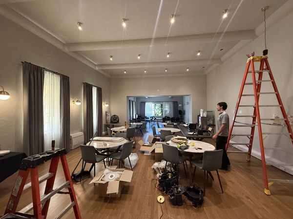 Commercial event hall with new recessed spotlights, Zion Electric technician on site – Zion Electric Inc., San Leandro electrician