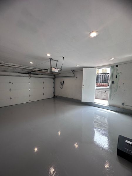 Garage with recessed lights and a wall-mounted EV charger connection β Zion Electric Inc., San Leandro electrician
