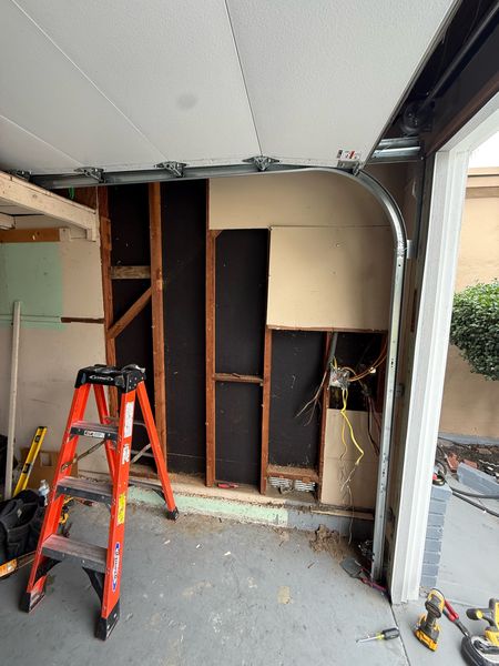 Garage wall opened up to install a new panel β Zion Electric Inc., San Leandro electrician