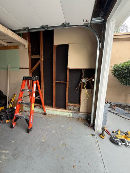 Garage wall opened for panel work, another view β Zion Electric Inc., San Leandro electrician