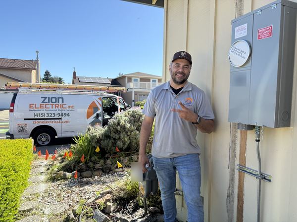 Owner Yonny Munoz with the Zion Electric van and a new meter/main service – Zion Electric Inc., San Leandro electrician