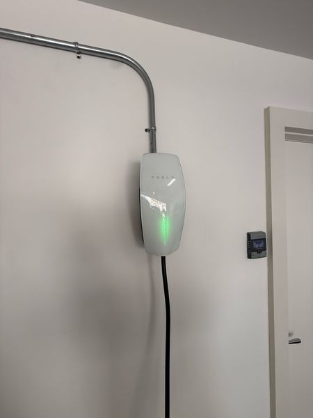 Finished Tesla Wall Connector installation with green status light – Zion Electric Inc., San Leandro electrician