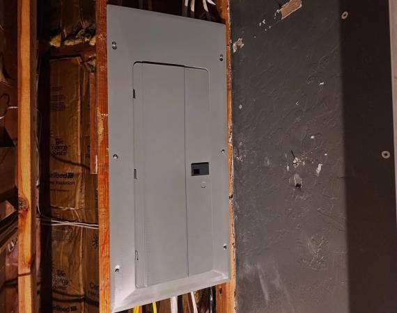 New panel with cover installed on a wood backboard β Zion Electric Inc., San Leandro electrician